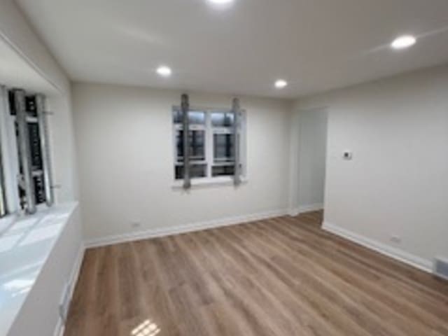 empty room featuring hardwood / wood-style flooring