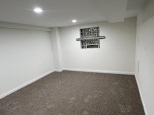 basement with dark carpet