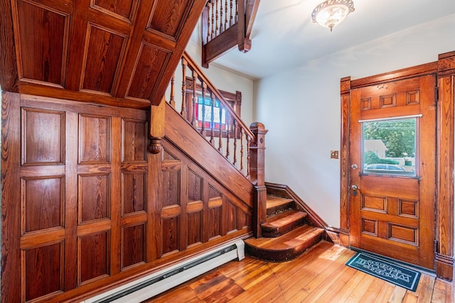 foyer featuring a baseboard radiator and wood-type flooring