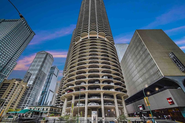 view of outdoor building at dusk