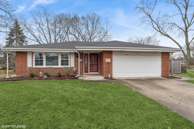 ranch-style home featuring a garage and a front lawn