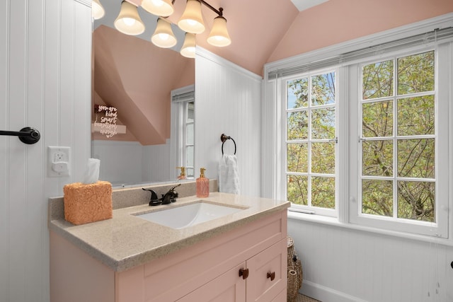 bathroom featuring vanity and vaulted ceiling