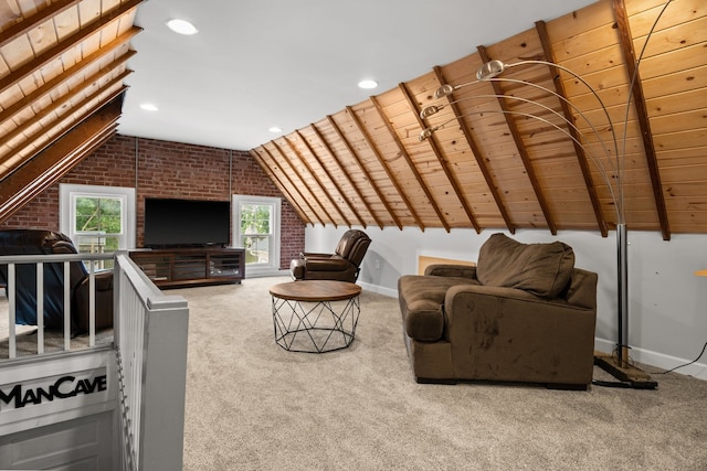 carpeted living room with vaulted ceiling with beams, wood ceiling, and brick wall