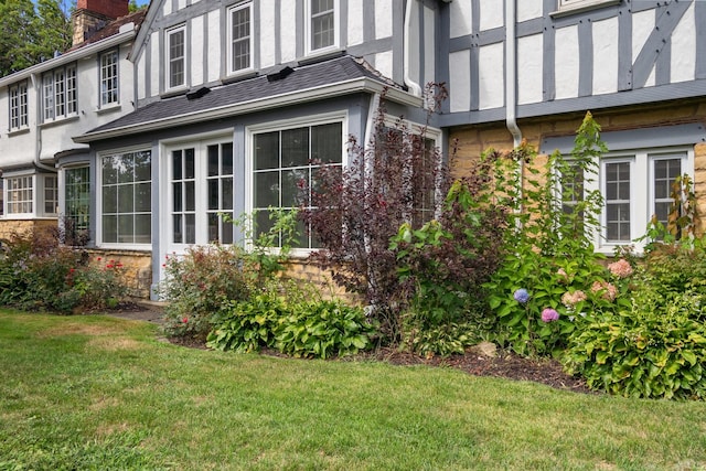 view of home's exterior with a yard