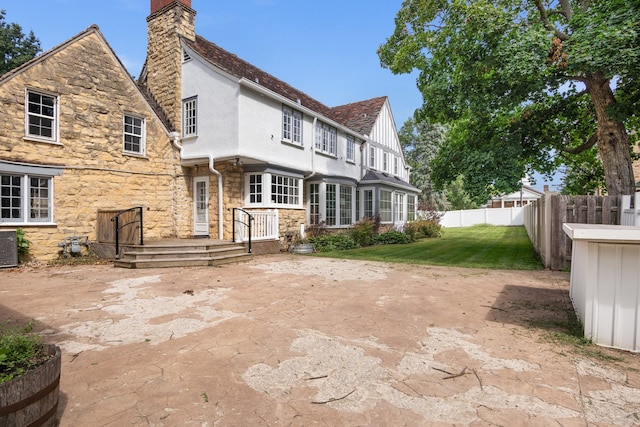 back of house with a patio area