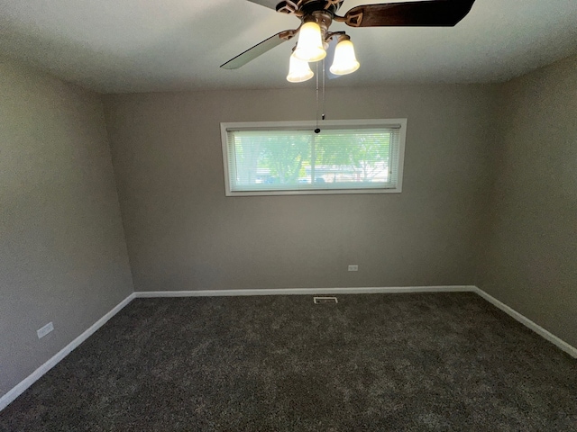 empty room with carpet flooring and ceiling fan