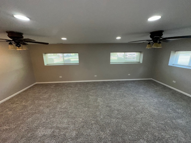 empty room with carpet flooring, a healthy amount of sunlight, and ceiling fan