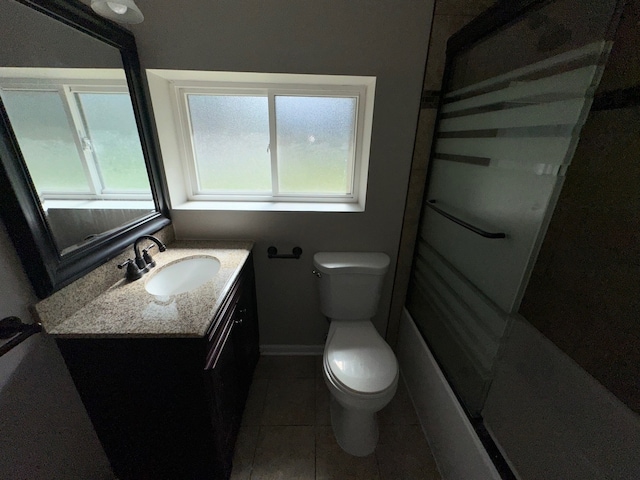 full bathroom featuring vanity, tile patterned flooring, shower / bathing tub combination, and toilet