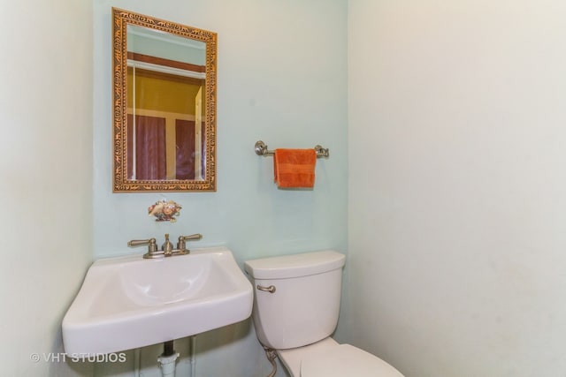 bathroom featuring sink and toilet