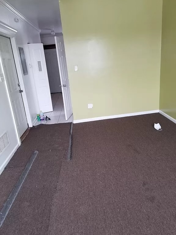 unfurnished bedroom with light carpet and ornamental molding