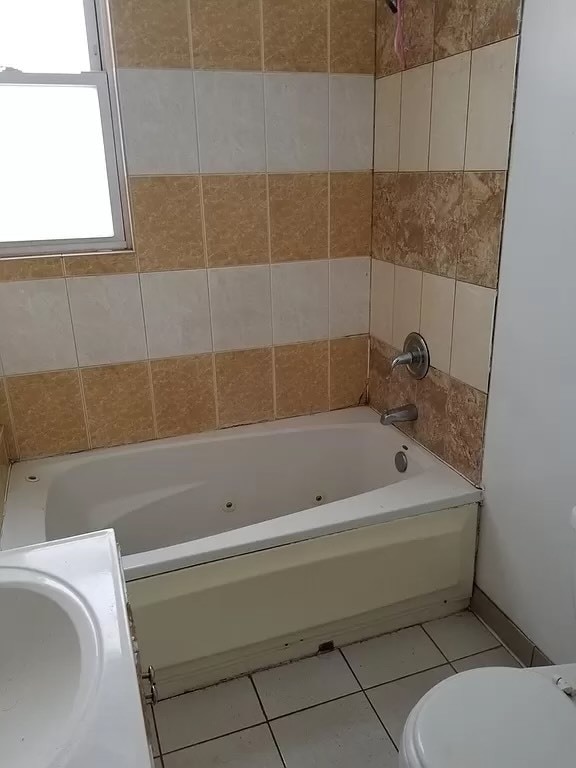 bathroom with vanity, toilet, and tile patterned flooring