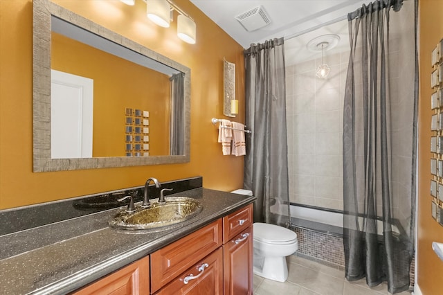 full bathroom with vanity, tile patterned flooring, toilet, and shower / tub combo