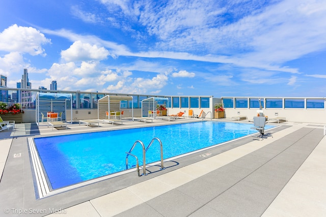 view of pool featuring a patio