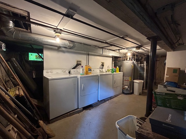 basement featuring gas water heater and separate washer and dryer