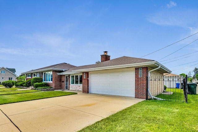 view of front facade featuring a garage and a front lawn