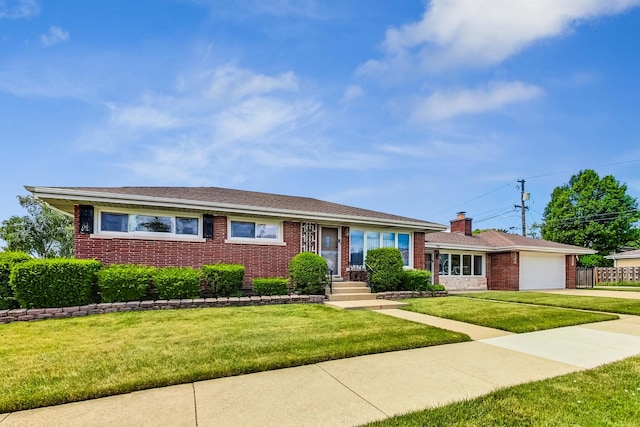 single story home featuring a garage and a front yard