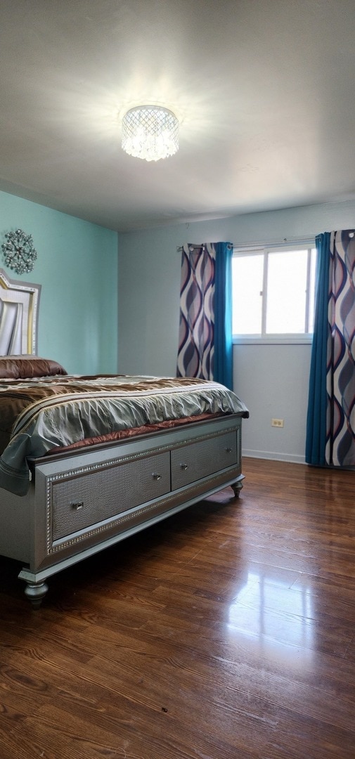 bedroom featuring dark hardwood / wood-style floors