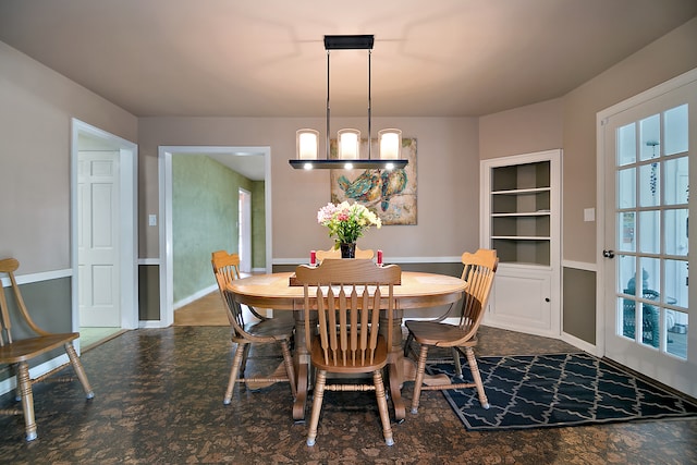 dining space with a notable chandelier