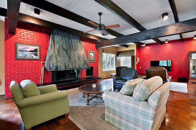 living room with ceiling fan, beamed ceiling, and parquet flooring