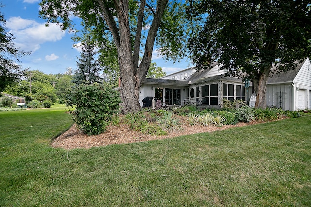 view of yard with a garage