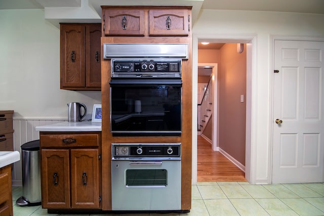 kitchen featuring oven and light hardwood / wood-style flooring