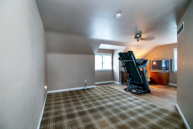 exercise area with lofted ceiling, ceiling fan, and carpet floors