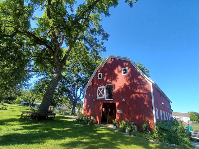 view of outbuilding with a lawn