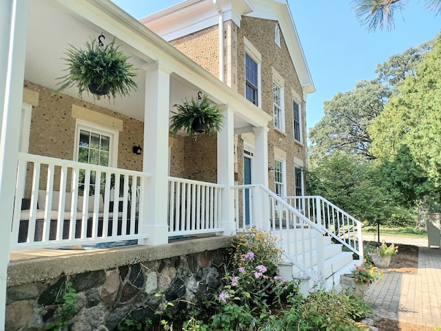 view of property exterior with a porch