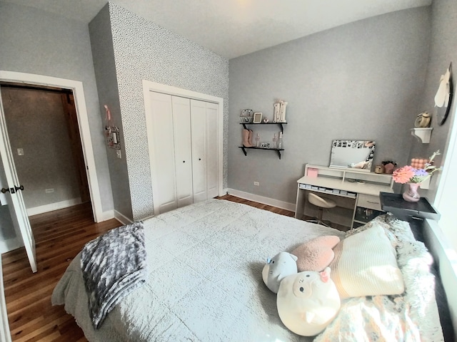 bedroom featuring hardwood / wood-style floors and a closet