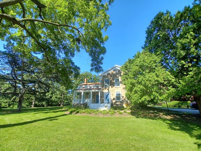 view of yard with a sunroom