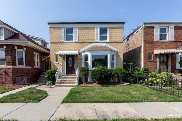 view of front of property with a front lawn