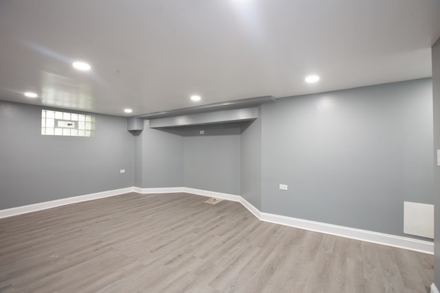 basement featuring light hardwood / wood-style flooring