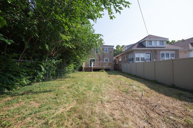 view of yard with a wooden deck