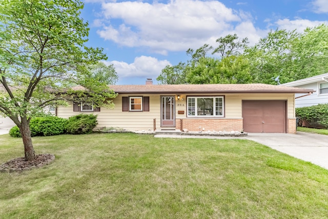 single story home featuring a garage and a front yard