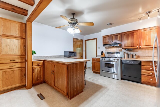 kitchen with light tile patterned flooring, kitchen peninsula, dishwasher, range with gas stovetop, and ceiling fan