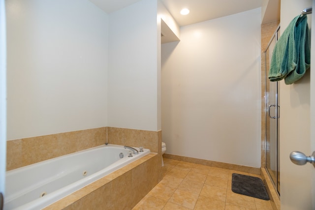 bathroom featuring shower with separate bathtub, toilet, and tile patterned floors