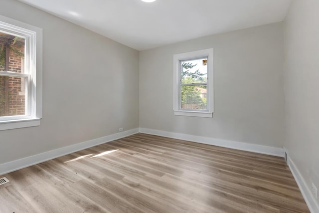 empty room featuring hardwood / wood-style flooring