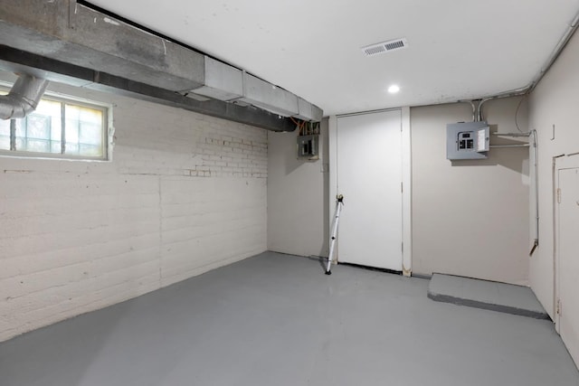 basement featuring electric panel