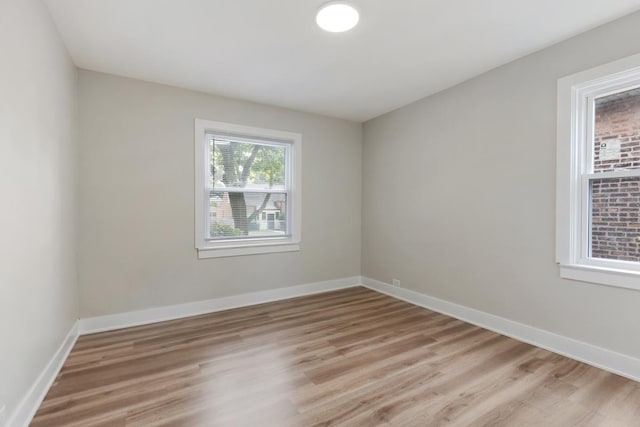 unfurnished room featuring light wood-type flooring