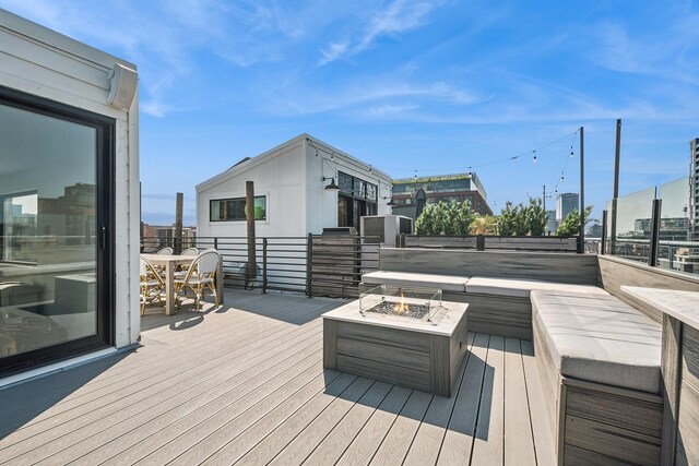 deck featuring an outdoor fire pit