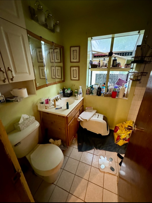 bathroom featuring vanity, tile patterned flooring, and toilet