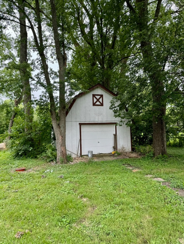 garage featuring a yard