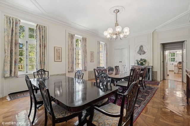 dining room with a wealth of natural light and crown molding