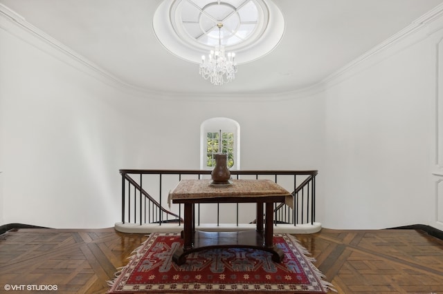 dining area with crown molding, a notable chandelier, and dark parquet flooring