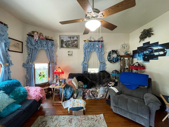 living room with ceiling fan and dark hardwood / wood-style floors