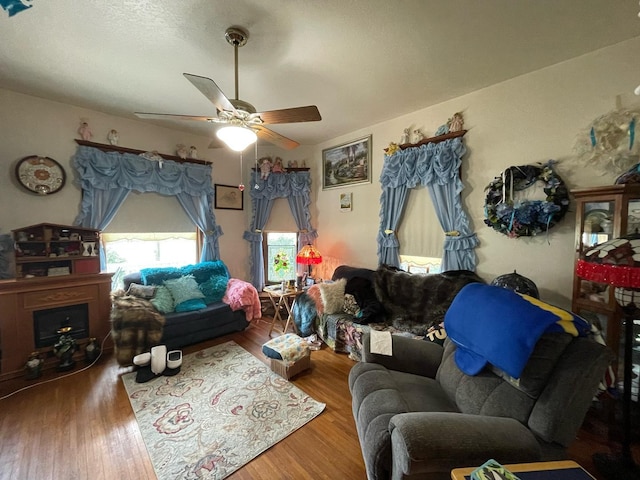 living room with hardwood / wood-style flooring and ceiling fan