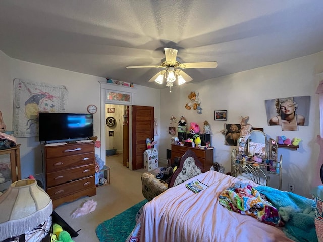 carpeted bedroom with ceiling fan