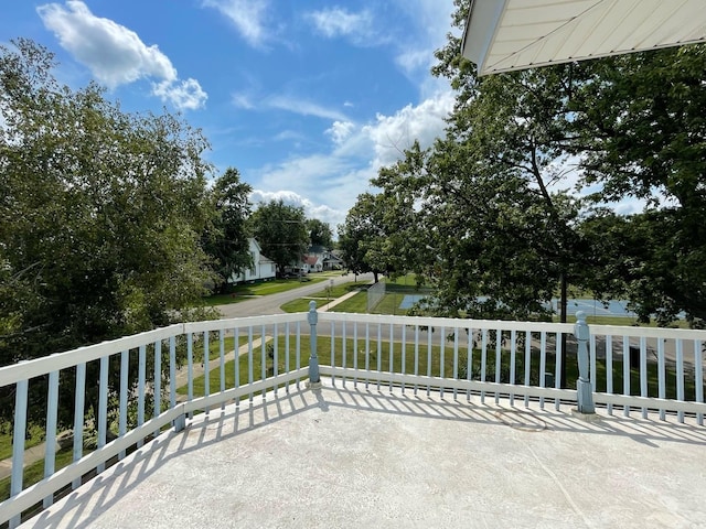 view of patio with a water view