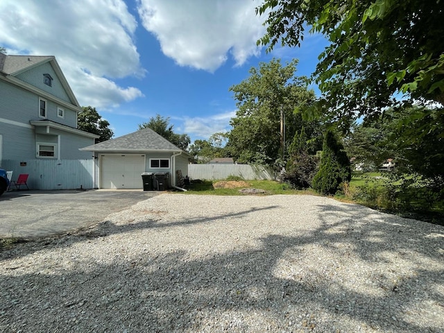 view of yard with an outbuilding and a garage