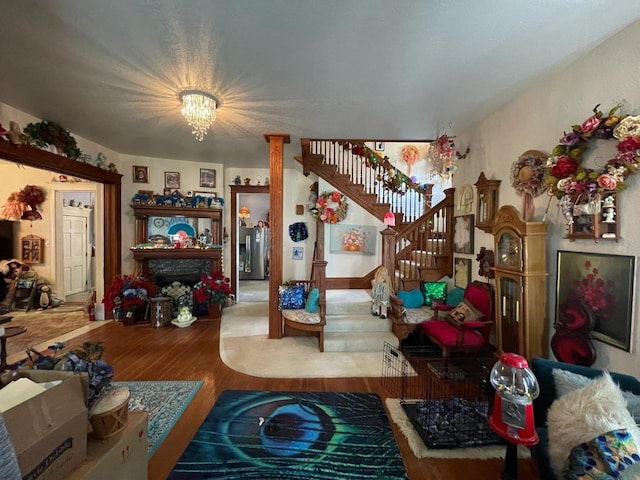 living room featuring hardwood / wood-style floors and a notable chandelier